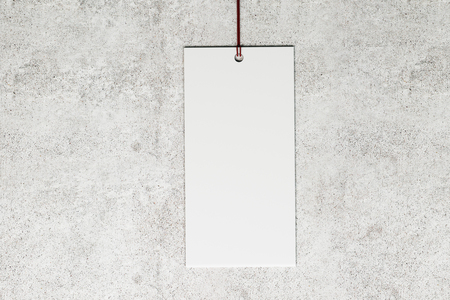 Blank price tag on light concrete background. Shop, sales and trade concept. Mock up, 3D Renderingの写真素材