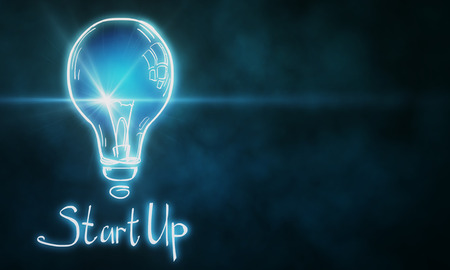 Creative glownig blue startup lamp on blurry background. Start up and innovation concept. 3D...