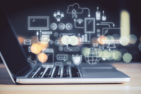 Close up of laptop with social media sketch on blurry background. Technology and communication concept. Double exposureの写真素材