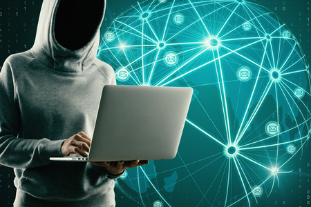 Hacker using laptop with glowing map interface and connections on blue background. Communication and data conceptの写真素材