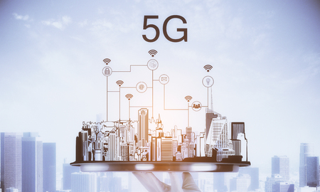Hand holding tray with creative city sketch and 5G internet connections. Communication and network...