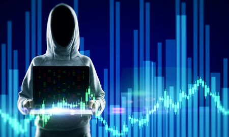 Hacker in hoodie holding laptop with glowing forex chart. Attack and invest concept. Double exposure