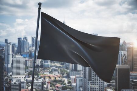Empty waving black flag on bright blue sky and city background. Mock up, 3D Renderingの写真素材