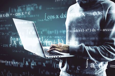 Hacker using laptop with abstract mathematical formulas. Computing, programming and malware concept....