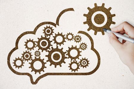 Data storage network technology concept. Hand with creative cloud and cogs on white backgroundの写真素材