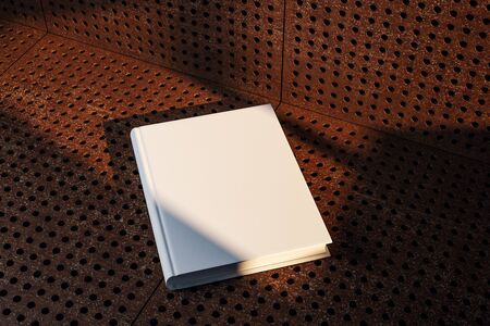 Empty white hardcover book on grunge background with shadows. Education and ad concept. Mock up, 3D Renderingの写真素材