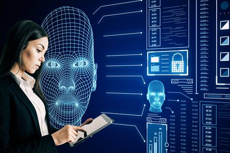 Portrait of young european businesswoman using abstract glowing head outline interface on dark...