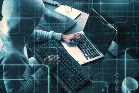 Hacker using laptop with abstract interface. Safety and criminal concept. Multiexposure