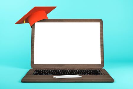 Empty white laptop with abstract tiny graduation cap on blue background. Online education and knowledge concept. Mock up, 3D Renderingの写真素材