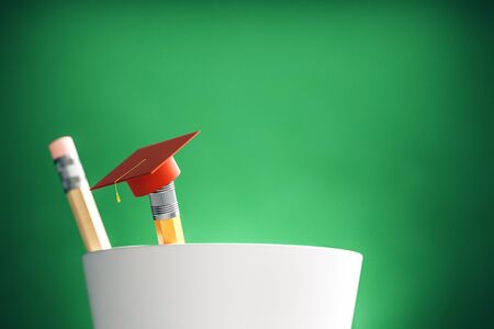 Close up of abstract graduation cap on pencil. Blurry green background. Education and back to school concept. 3D Renderingの写真素材