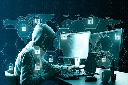 Hacker at desktop using laptop with creative glowing digital padlock interface on dark background...