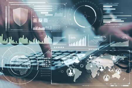 Trading concept with digital screen with diagram, graphs and data analysis and man hand using...
