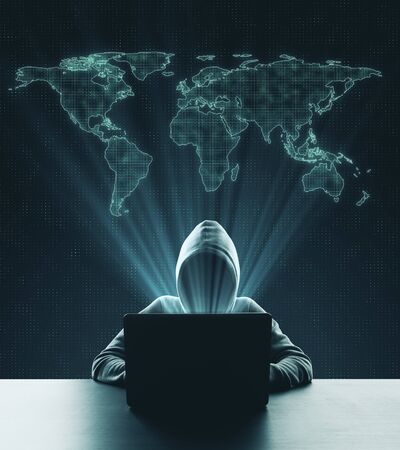 World digital crime problem concept with hacker working with laptop and world map layout above.の写真素材