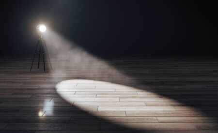 Creative studio interior with spotlight on wooden floor. Stage concept. 3D Renderingの写真素材