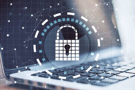 Close up of laptop with digital padlock interface on desktop and blurry background. Safety and...