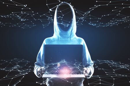 Hacker in hoodie using laptop with glowing polygonal hologram on dark background. Innovation, ai and...