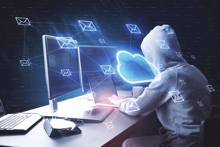 Hacker using computer with cloud email network. Cloud computing and hacking concept. Double exposure...