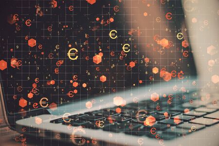 Side view of notebook with glowing digital euro signs on blurry desktop background. Cryptocurrency,...