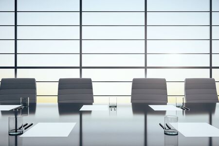 Modern meeting room interior with sunset, glasses and paper on desk and reflections. 3D Rendering