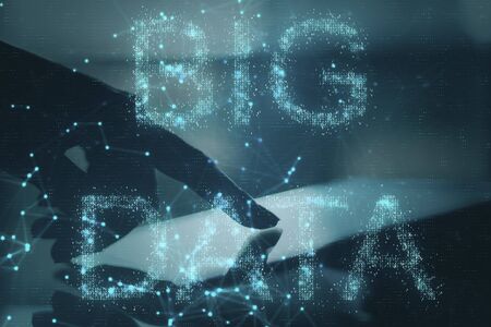 Close up of hand using tablet with abstract AI hologram on blurry background. Artificial...