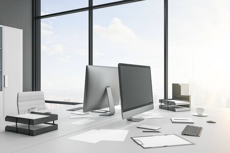 Close of of desktop in contemporary coworking office interior with city view, daylight, supplies and...