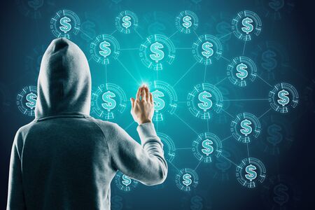 Hacker hand using creative glowing blue dollar icon interface hud on dark blurry background. Cryptocurrency and malware concept の写真素材