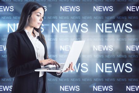 Businesswoman with laptop.  Innovation and news media conceptの写真素材