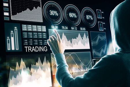 Hacker pushing  glowing forex chart on dark background. Trade and malware conceptの写真素材