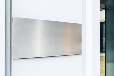 Empty rectangular metal stopper on wall. Mock upの写真素材