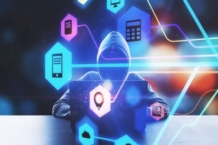 Network and hacking concept. Hacker at desktop using laptop with creative digital business interface...