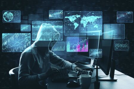 Hacker at desktop using laptop with digital business interface. Hacking and innovation concept