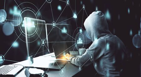 Hacker using computer with glowing human resource interface. Communication and malware concept.