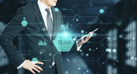 Businessmen holding digitel tablet with business report. Team and device concept. Close upの写真素材