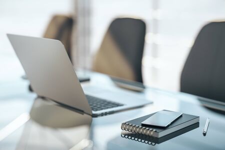Office desk with laptop, smartphone and supplies. Business and communication concept. 3D Rendering
