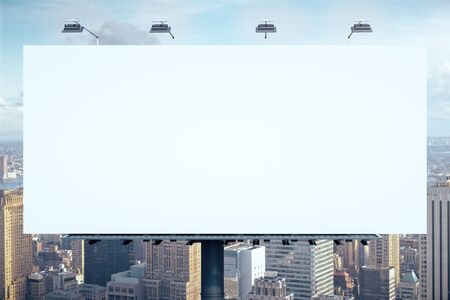 Blank white billboard on city background. Public ad and business concept. Mock upの写真素材