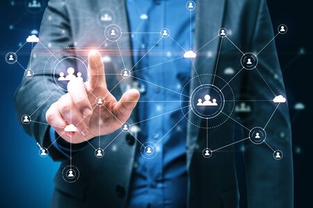 Businessman using social network interface and glowing human resource concept