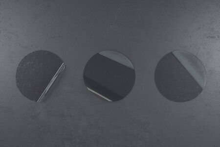 Three transparent plastic round sticker on black concrete wall. Presentation concept. 3D Renderingの写真素材