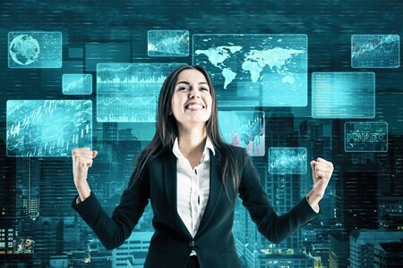 Happy businesswoman and digital business interface on virtual screen. Global business and media concept.の写真素材