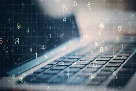 Laptop with number on blurry desktop backround. Programming and communication concept.