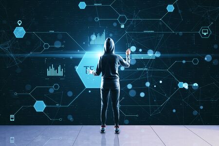 Hacker using glowing business data on virtual screen. Hacking and cyber attack concept.