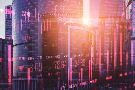 Glowing stock chart on blurry modern city background. Trade and investment concept. Multiexposure