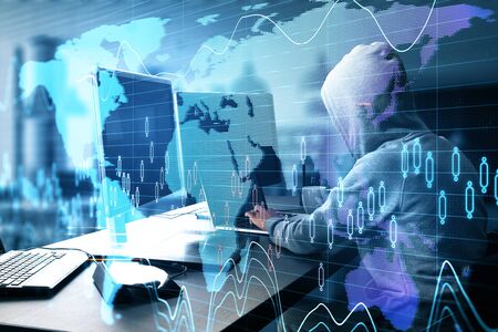 Hacker using laptop with global business scheme in office. Hacking and cyber attack concept.