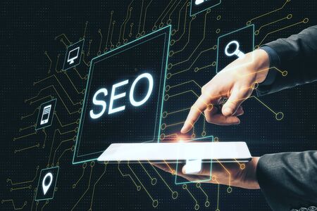Hand using digital tablet and creative digital SEO interface. Search engine optimization concept. 3D...