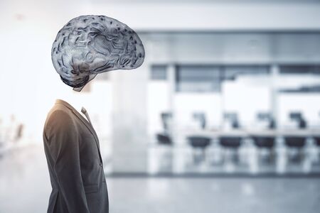 Businessman with a drawing brain instead of a head on blurry office  background. Artificial intelligence concept.の写真素材