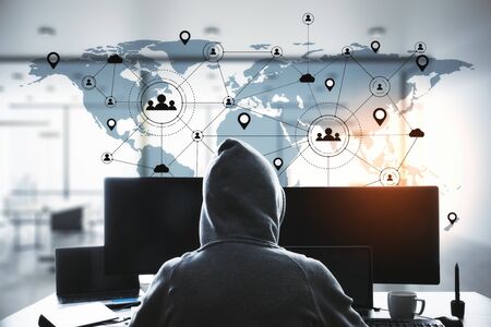 Hacker using computer with remote work interface on blue world map. Remote access chain...