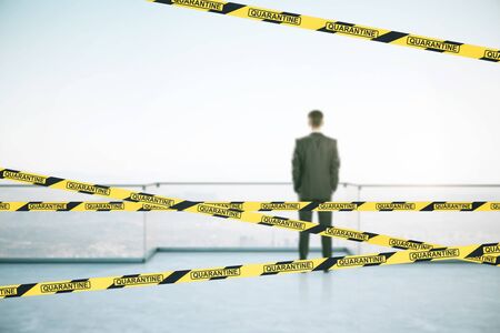Businessman standing on roofrop with panoramic city view and yellow and black stripes. Coronavirus...