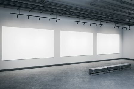 Minimalistic concrete interior with three blank billboards on wall and bench. Gallery concept. Mock up, 3D Renderingの写真素材