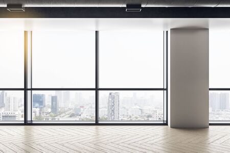 Light empty office interior with panoramic city view, reflections and daylight.  Workplace and...