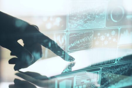 Hand using digital tablet and digital system security interface on screen. Business and security...