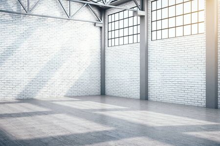 Contemporary warehouse interior with window and daylight. Industrial and exhibition concept. 3D Renderingの写真素材